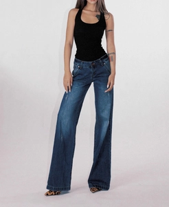 Detailed view of vintage washed deep blue wide-leg jeans with premium denim texture details
