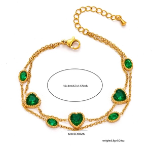 Detail view of double-layer gold heart bracelet with green zircon and 16+4cm chain