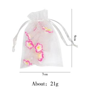 White organza drawstring gift bag with pink decorative flowers sized 7x9cm weighing 21g