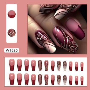 Press-on nails in burgundy and nude pink with gold foil accents and 3D wave textures