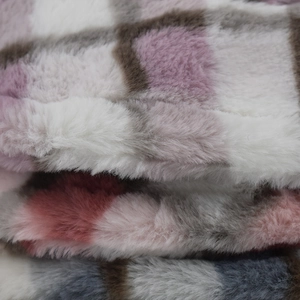 Plush faux fur winter bucket hat with colorful plaid pattern in pink white and grey