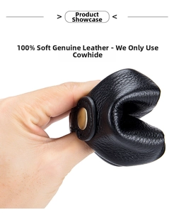 Detail of soft black pebble grain leather pouch showing material flexibility and gold snap