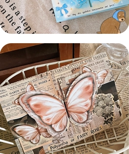 Detailed view of vintage 3D butterfly greeting card with elegant floral rose patterns