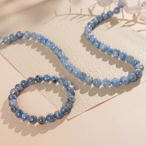 Detailed view of the 8-10mm blue kyanite round beads on the necklace and bracelet