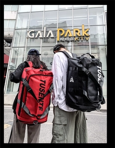 Detail of large-capacity Oxford fabric travel backpack showing shoulder straps and side pockets