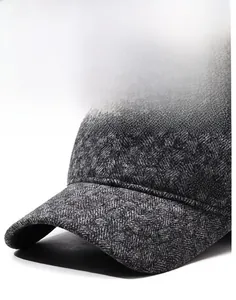 Detailed macro view of dark grey herringbone fabric and SP Sport metal emblem on baseball cap