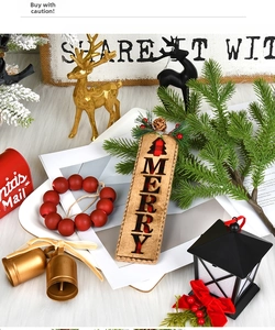 Detail of Christmas decor with gold reindeer, festive wooden Merry sign and red beads