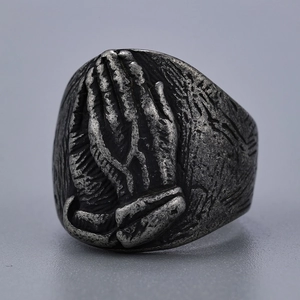 Vintage stainless steel ring featuring detailed 3D embossed praying hands in antique silver finish
