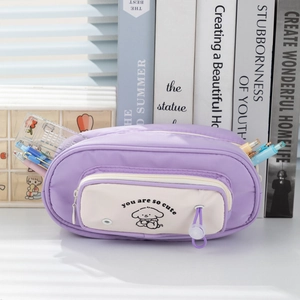 Detail of purple multi-layer pencil case showing large storage space with pens and ruler