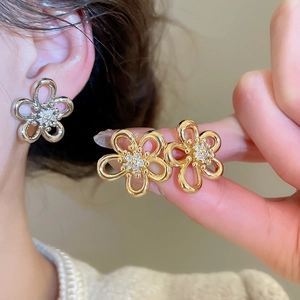Elegant floral zircon stud earrings in gold and silver finish for a minimalist style