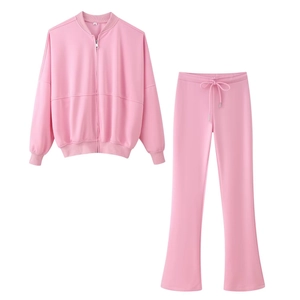 Women's pink two-piece set featuring a zip-up bomber jacket and high-waist flare pants