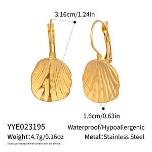 Detail view of golden textured leaf earrings with precise dimensions and weight specs