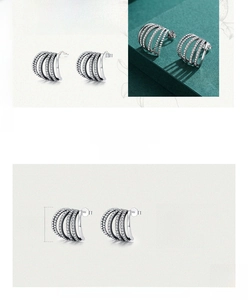 Detailed macro view of 925 sterling silver hoop earrings with cubic zirconia inlay
