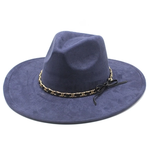 Detail of navy blue suede fedora featuring golden chain link and black ribbon bow