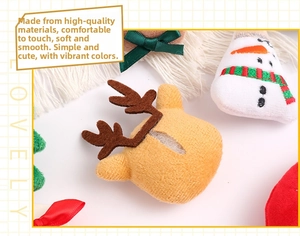 Detail of plush Christmas elk and snowman ornaments featuring soft festive felt textures