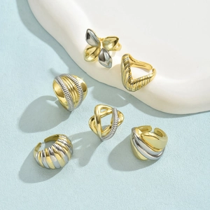 Six-piece set of 18K gold and silver two-tone stackable rings with textured designs