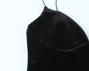 Detailed view of the velvet fabric texture and strap on this black women jumpsuit