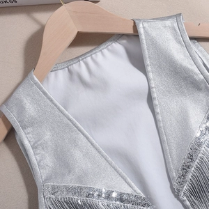 Close-up of silver sequin fringe vest featuring metallic texture and detailed craftsmanship