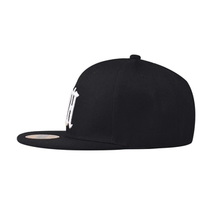 Classic black cotton flat brim baseball cap with white embroidered letter B in side view