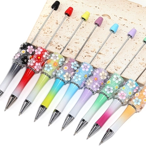 Detail of gradient DIY beadable pens featuring 3D flowers and sparkling rhinestone accents