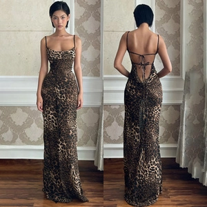 Front and back view of a slim leopard print maxi dress with open back tie design