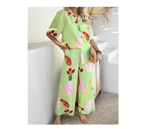 Detail of bohemian two-piece set with vibrant fruit prints and checkerboard patterns