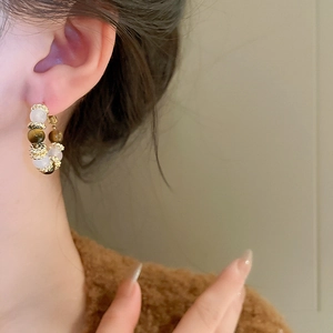 Vintage gold hoop earrings with brown tiger eye and white cat eye stone beads