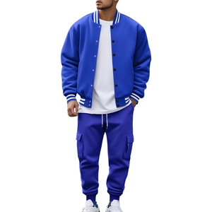 Detail of blue varsity jacket and matching joggers with white stripes on sporty knit fabric