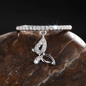 Macro shot of a butterfly pendant ring with shimmering cubic zirconia and pavé setting