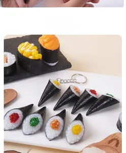 Detailed view of realistic sushi keychain models featuring temaki and gunkan designs