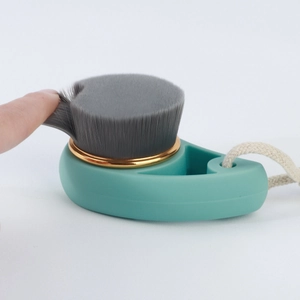 Bamboo charcoal facial cleansing brush with gold ring and soft bristles for face washing