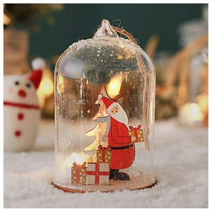 Detail of Christmas glass ornament with Santa wood carving and warm LED lights