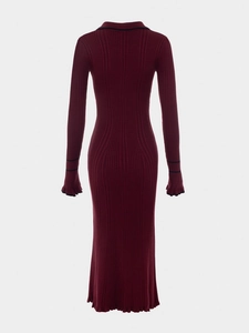 Detail of burgundy ribbed knit midi dress with flared sleeves and black edge contrast
