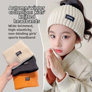 Elastic knitted wide headband for girls in beige, black and orange with logo patch