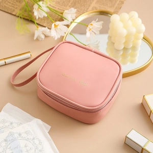 Pink waterproof PU sanitary napkin storage bag with Sunny Girl embroidery and handle