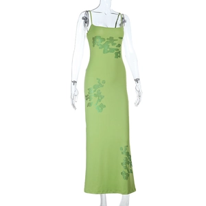 Close-up of green floral sequin details on a slim-fit summer camisole maxi dress