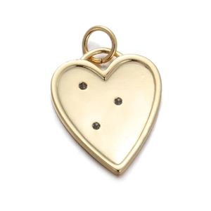 Detailed view of a gold heart pendant with three sparkling embedded crystals and top ring