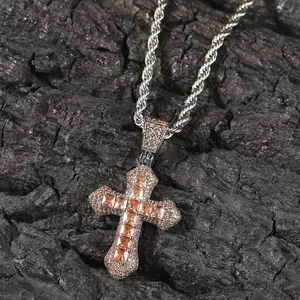 Detail of hip hop cross pendant with champagne zircon and iced out cubic zirconia stones