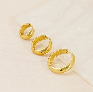 Three pairs of polished 18K gold plated stainless steel hoop earrings in varying sizes