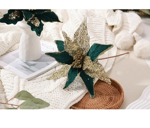 Detail of dark green velvet and gold glitter poinsettia flower for Christmas decor