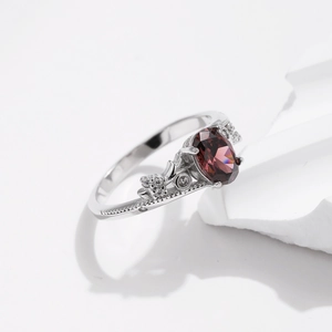 Vintage S925 sterling silver ring with oval reddish-brown gemstone and zircon accents
