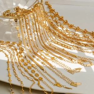 Collection of gold titanium steel bracelets including heart charms and various link chains