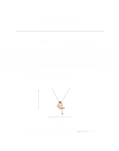 Detailed view of the 18k gold-plated cross pendant with zircon and shell material
