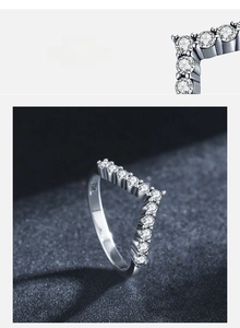 Detailed view of hand-set 5A zircon stones on a V-shaped 925 sterling silver ring