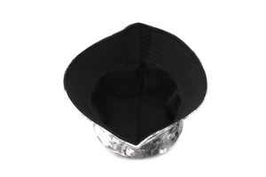 Close-up of tie-dye bucket hat with marble pattern canvas and black inner lining