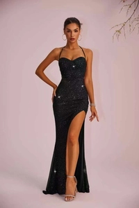 Elegant black halter evening gown featuring sparkling sequins and a high thigh-high slit
