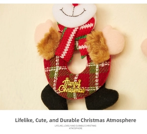 Detail of red plaid Merry Christmas plush ornament with golden text and fur trim