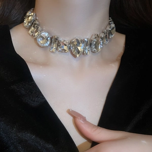 Exaggerated silver choker necklace with rhinestones in teardrop and square shapes