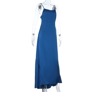 Detail of sleek dark blue satin maxi dress showing silk texture and slim fit design