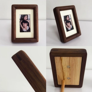 Black walnut magnetic photo frame showing front view and back stand on white table